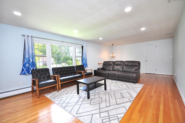 83 Elizabeth St, South Windsor, CT 06074 - living area with wood finished floors, recessed lighting, a chandelier, and baseboards