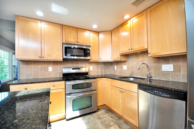 83 Elizabeth St, South Windsor, CT 06074 - kitchen with appliances with stainless steel finishes, a sink, light brown cabinetry, decorative backsplash, and recessed lighting