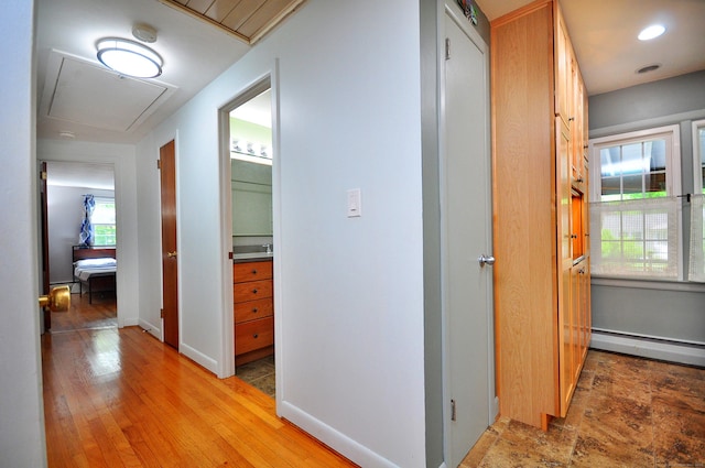 83 Elizabeth St, South Windsor, CT 06074 - hall with attic access, a baseboard heating unit, and baseboards