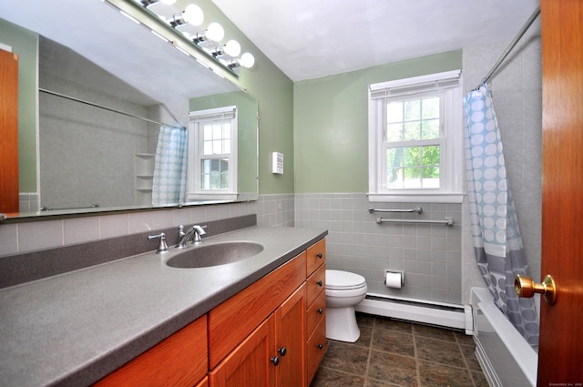 83 Elizabeth St, South Windsor, CT 06074 - full bathroom with a baseboard heating unit, vanity, toilet, shower / bath combination with curtain, and tile walls