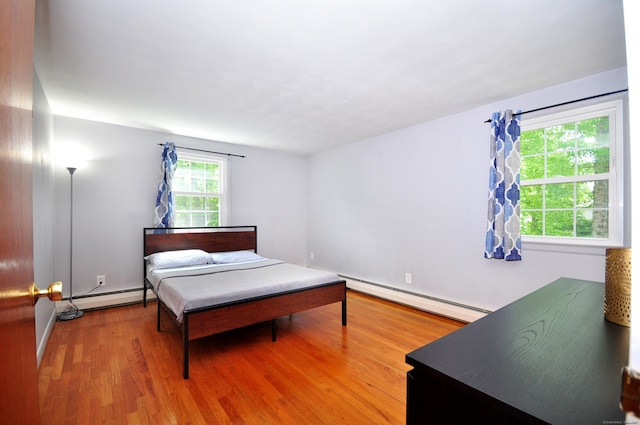 83 Elizabeth St, South Windsor, CT 06074 - bedroom featuring a baseboard radiator and wood finished floors