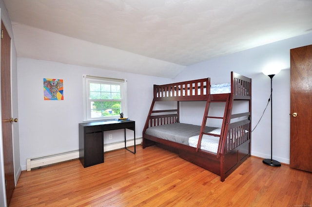 83 Elizabeth St, South Windsor, CT 06074 - bedroom featuring a baseboard heating unit, lofted ceiling, light wood-type flooring, and baseboards