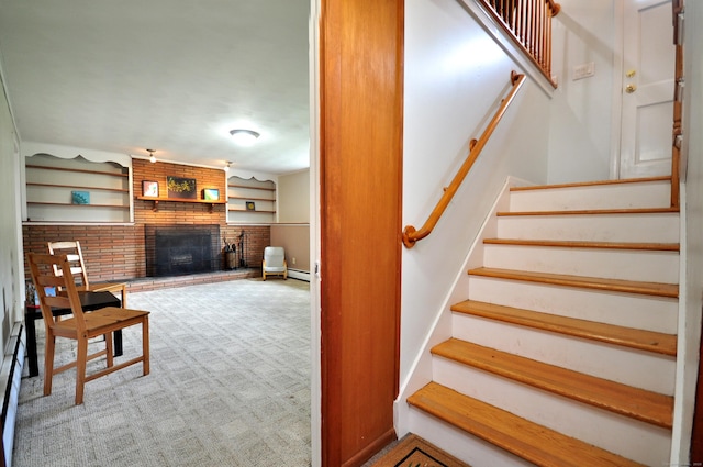 83 Elizabeth St, South Windsor, CT 06074 - staircase featuring a brick fireplace and baseboard heating