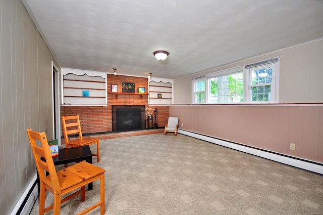 83 Elizabeth St, South Windsor, CT 06074 - sitting room featuring a baseboard radiator, a brick fireplace, baseboard heating, wood walls, and carpet flooring