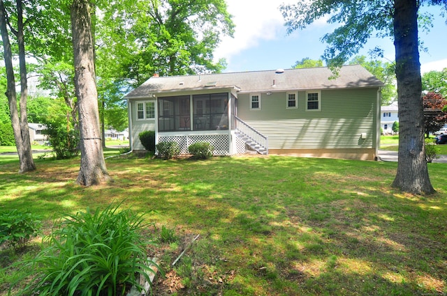 83 Elizabeth St, South Windsor, CT 06074 - back of house featuring a sunroom, a yard, and stairs