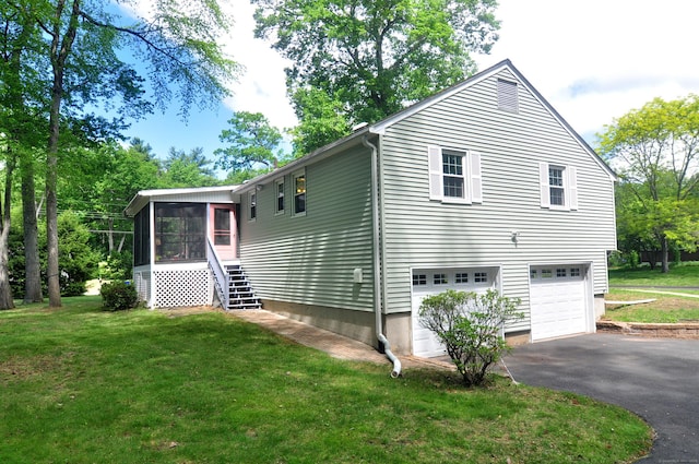 83 Elizabeth St, South Windsor, CT 06074 - view of side of property featuring a sunroom, driveway, an attached garage, a yard, and stairway