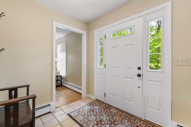 61 Winding Rdg, Southington, CT 06489 - foyer entrance featuring a baseboard radiator, plenty of natural light, light tile patterned flooring, and baseboards