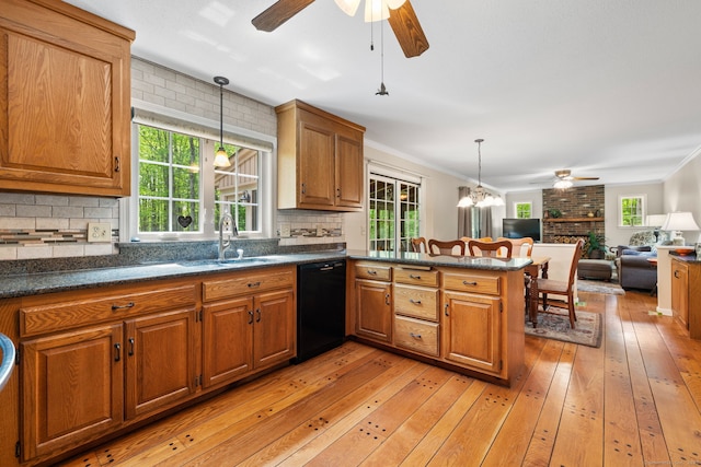 61 Winding Rdg, Southington, CT 06489 - kitchen with black dishwasher, a ceiling fan, a sink, brown cabinets, and crown molding