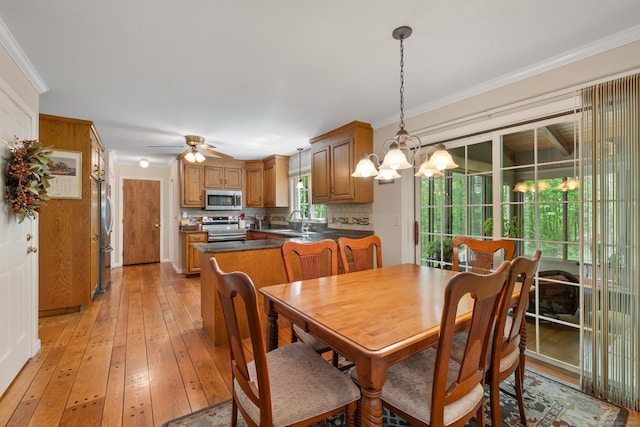 61 Winding Rdg, Southington, CT 06489 - dining room with ornamental molding, light wood-style flooring, a ceiling fan, and a chandelier