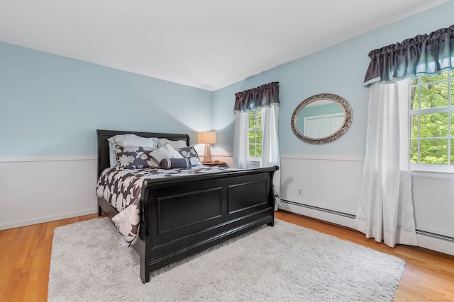 61 Winding Rdg, Southington, CT 06489 - bedroom with multiple windows, wood finished floors, and baseboard heating
