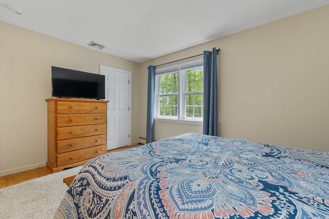 61 Winding Rdg, Southington, CT 06489 - bedroom with wood finished floors, baseboards, and baseboard heating