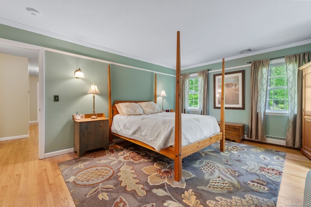 61 Winding Rdg, Southington, CT 06489 - bedroom featuring wood finished floors, ornamental molding, multiple windows, a baseboard heating unit, and baseboards