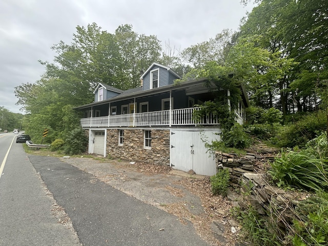 29 Middle Tpke, Mansfield, CT 06268 - view of front of property with stone siding and an attached garage