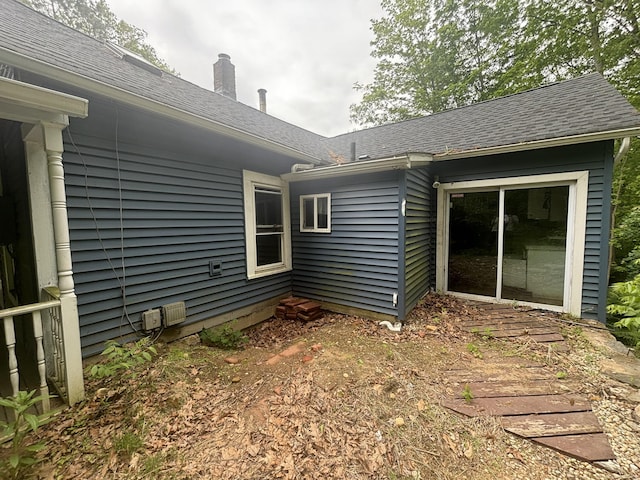 29 Middle Tpke, Mansfield, CT 06268 - rear view of house featuring a chimney and roof with shingles