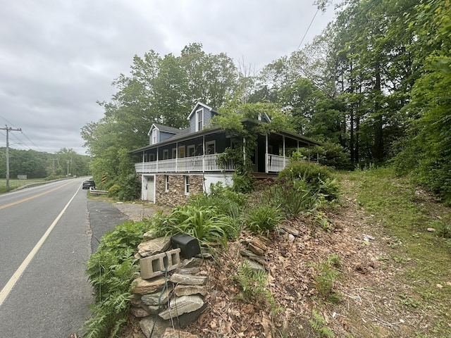 29 Middle Tpke, Mansfield, CT 06268 - view of front of home with stone siding and a sunroom