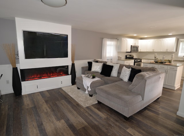 155 Cedar St, New Haven, CT 06519 - living room featuring dark wood-type flooring, a glass covered fireplace, and recessed lighting