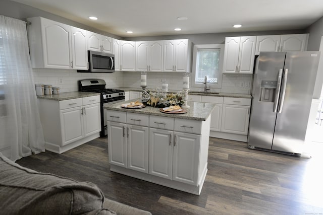 155 Cedar St, New Haven, CT 06519 - kitchen featuring stainless steel appliances, dark wood finished floors, a sink, decorative backsplash, and recessed lighting