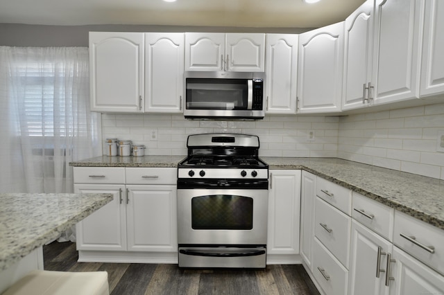 155 Cedar St, New Haven, CT 06519 - kitchen featuring appliances with stainless steel finishes, white cabinets, and dark wood-style flooring