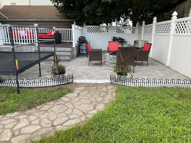 155 Cedar St, New Haven, CT 06519 - fenced backyard featuring a wooden deck and a patio area