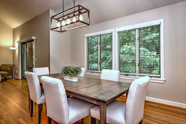 690 Forest Rd Unit 442, West Haven, CT 06516 - dining room featuring wood finished floors, baseboards, and a chandelier