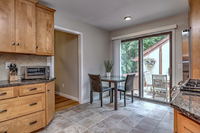 690 Forest Rd Unit 442, West Haven, CT 06516 - dining area with baseboards and light stone finish flooring