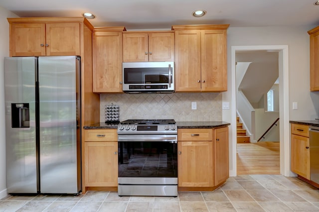 690 Forest Rd Unit 442, West Haven, CT 06516 - kitchen featuring appliances with stainless steel finishes, dark stone countertops, recessed lighting, and backsplash