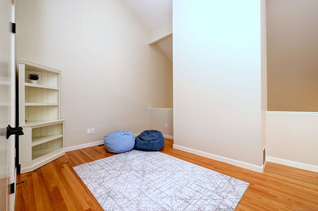 690 Forest Rd Unit 442, West Haven, CT 06516 - misc room featuring wood finished floors, lofted ceiling, and baseboards