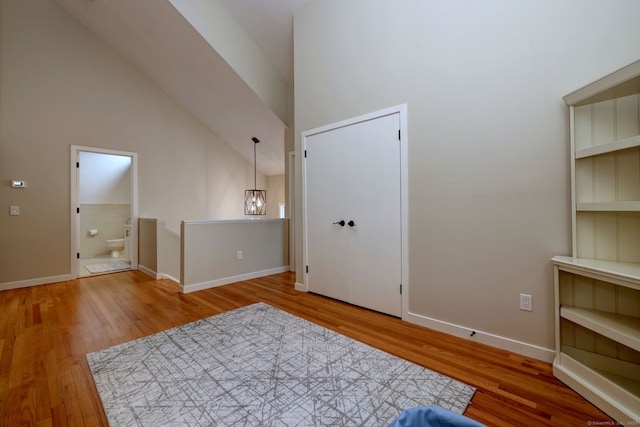 690 Forest Rd Unit 442, West Haven, CT 06516 - unfurnished bedroom with wood finished floors, baseboards, and ensuite bathroom