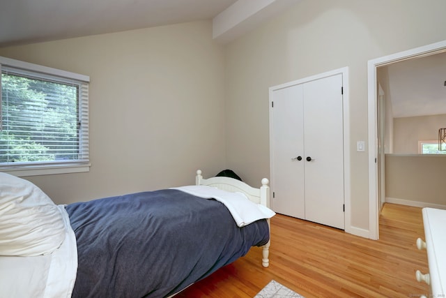 690 Forest Rd Unit 442, West Haven, CT 06516 - bedroom with vaulted ceiling, light wood-style flooring, and a closet