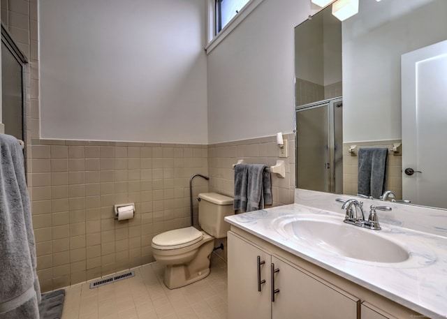 690 Forest Rd Unit 442, West Haven, CT 06516 - full bath featuring tile walls, tile patterned flooring, a stall shower, toilet, and vanity