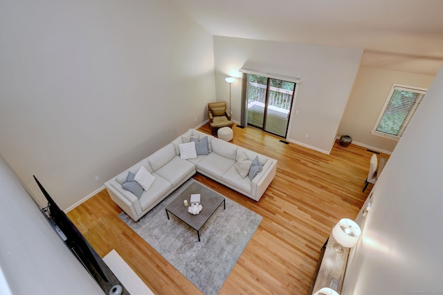 690 Forest Rd Unit 442, West Haven, CT 06516 - living area with light wood-style floors, baseboards, and lofted ceiling