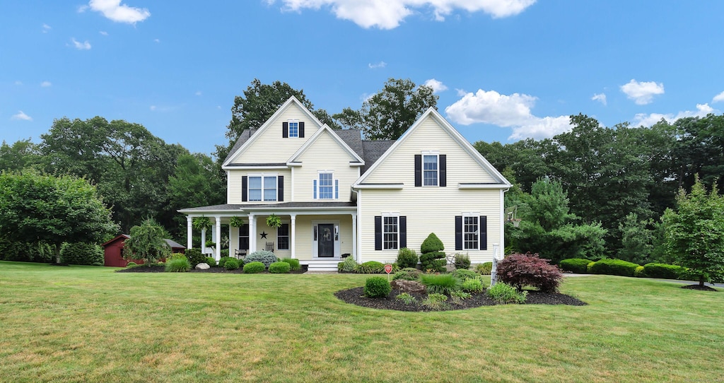 6 Hinman Meadow Rd, Burlington, CT 06013 - view of front facade featuring a porch and a front lawn