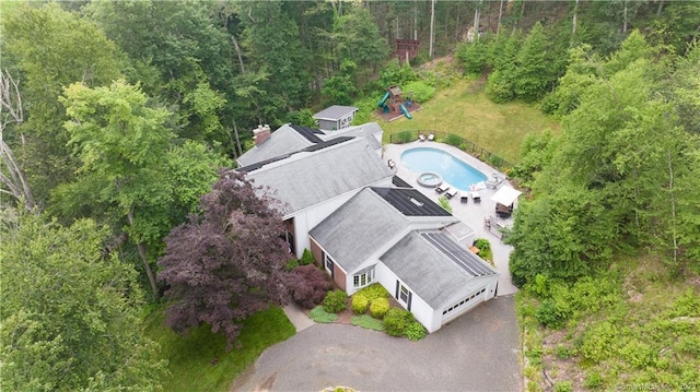 36 Old Johnson Ln, Middletown, CT 06457 - drone / aerial view of a pool area and a heavily wooded area