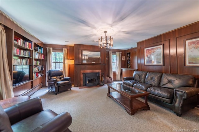 36 Old Johnson Ln, Middletown, CT 06457 - living room with wooden walls, a chandelier, carpet flooring, and built in features