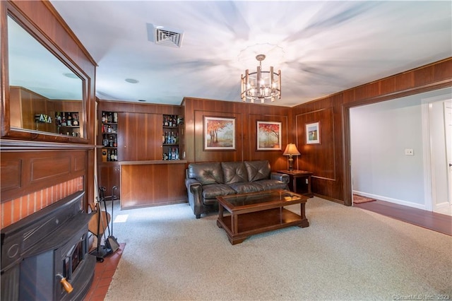 36 Old Johnson Ln, Middletown, CT 06457 - carpeted living area with a chandelier, wood walls, and baseboards