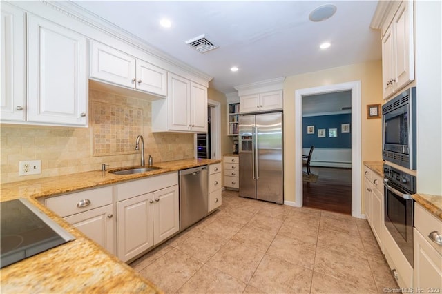 36 Old Johnson Ln, Middletown, CT 06457 - kitchen featuring built in appliances, a sink, tasteful backsplash, white cabinetry, and recessed lighting