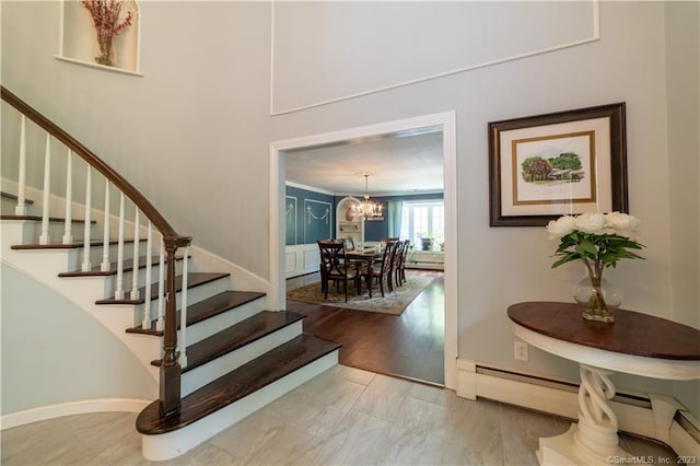 36 Old Johnson Ln, Middletown, CT 06457 - staircase with a chandelier, a baseboard heating unit, and baseboards