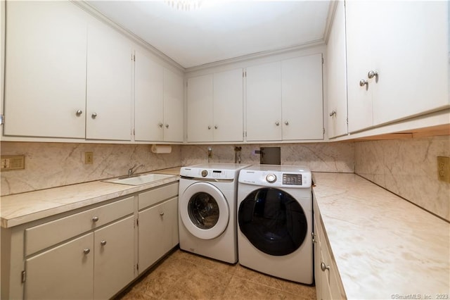 36 Old Johnson Ln, Middletown, CT 06457 - washroom featuring washer and clothes dryer, cabinet space, and crown molding