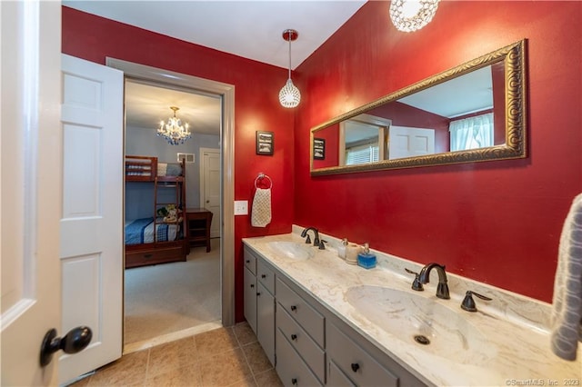 36 Old Johnson Ln, Middletown, CT 06457 - bathroom featuring double vanity, a chandelier, tile patterned floors, and ensuite bath