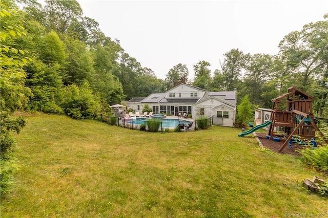 36 Old Johnson Ln, Middletown, CT 06457 - view of green lawn featuring an outdoor pool, a playground, and view of wooded area