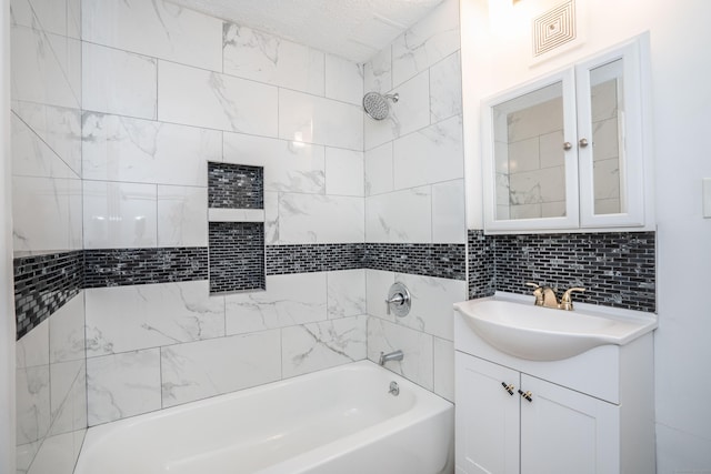 104 Oakwood Ave Apt T3, West Hartford, CT 06119 - bathroom featuring tub / shower combination, vanity, backsplash, and a textured ceiling