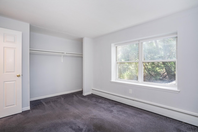 104 Oakwood Ave Apt T3, West Hartford, CT 06119 - unfurnished bedroom featuring baseboard heating, dark carpet, baseboards, and a closet