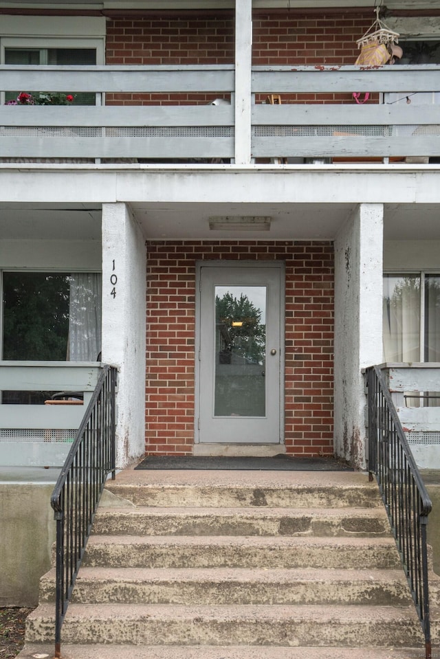 104 Oakwood Ave Apt T3, West Hartford, CT 06119 - property entrance featuring brick siding and a balcony