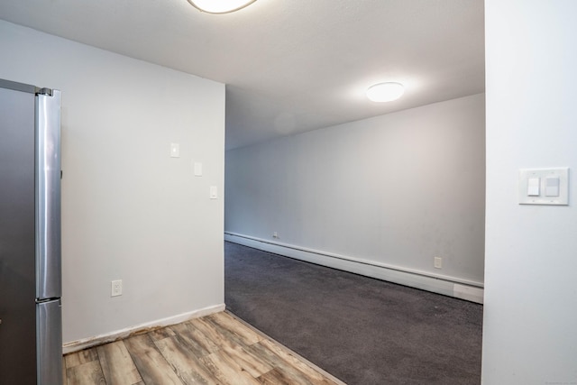 104 Oakwood Ave Apt T3, West Hartford, CT 06119 - empty room with baseboard heating, wood finished floors, and baseboards