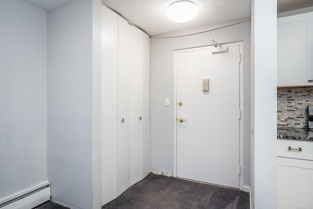 104 Oakwood Ave Apt T3, West Hartford, CT 06119 - doorway featuring a baseboard heating unit and dark carpet