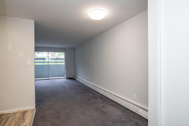104 Oakwood Ave Apt T3, West Hartford, CT 06119 - carpeted spare room featuring a baseboard heating unit and baseboards