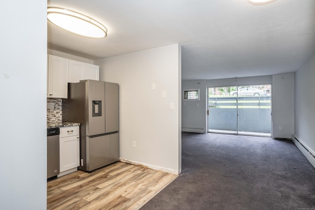 104 Oakwood Ave Apt T3, West Hartford, CT 06119 - kitchen featuring stainless steel appliances, a baseboard heating unit, white cabinetry, decorative backsplash, and open floor plan