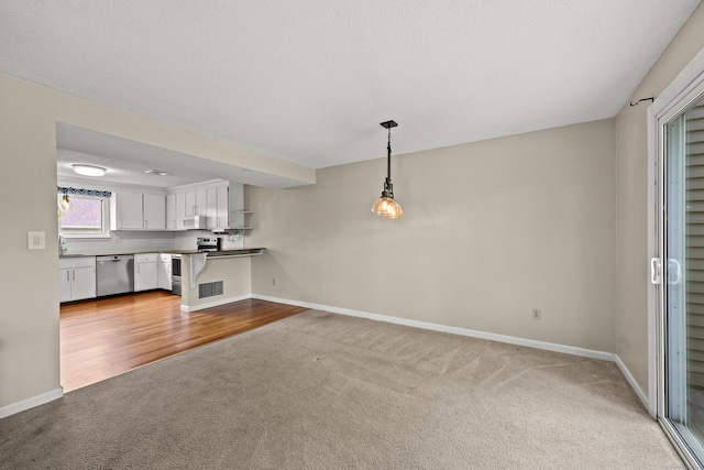 36 Wood Duck Ln Unit 36, Simsbury, CT 06081 - unfurnished living room with carpet flooring and baseboards