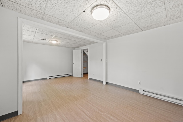 36 Wood Duck Ln Unit 36, Simsbury, CT 06081 - empty room with baseboard heating, a paneled ceiling, wood finished floors, and baseboards