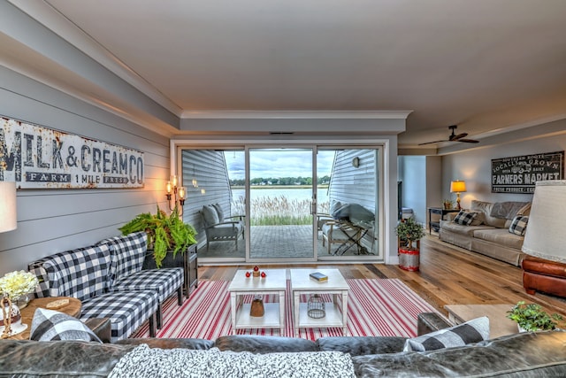 714 Popes Island Rd Unit 714, Milford, CT 06461 - living area with wood finished floors, a water view, a ceiling fan, and crown molding